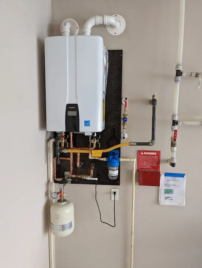 Professional plumber installing copper piping in a Argentine home